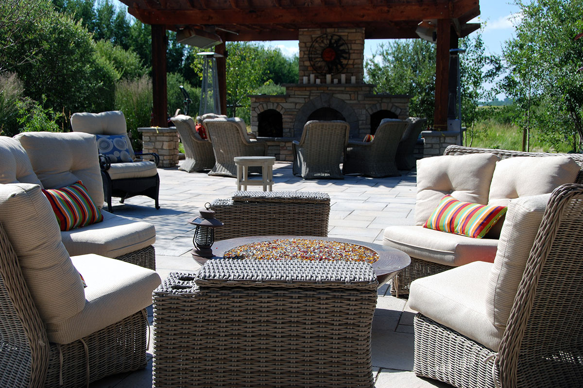 Outdoor backyard fire pit and sitting area courtesy of Ananda Lanscapes in Calgary 